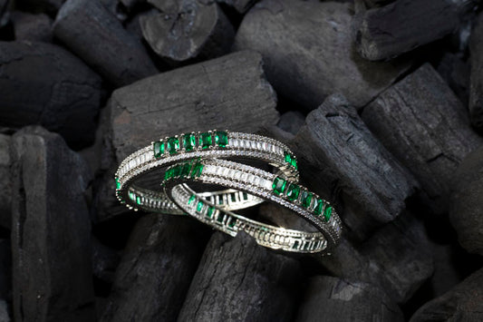 Diamond and emerald bangles