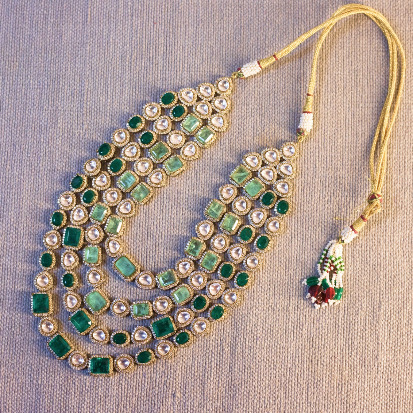 4 line Polki , emerald and Russian emeralds in silver and gold platting